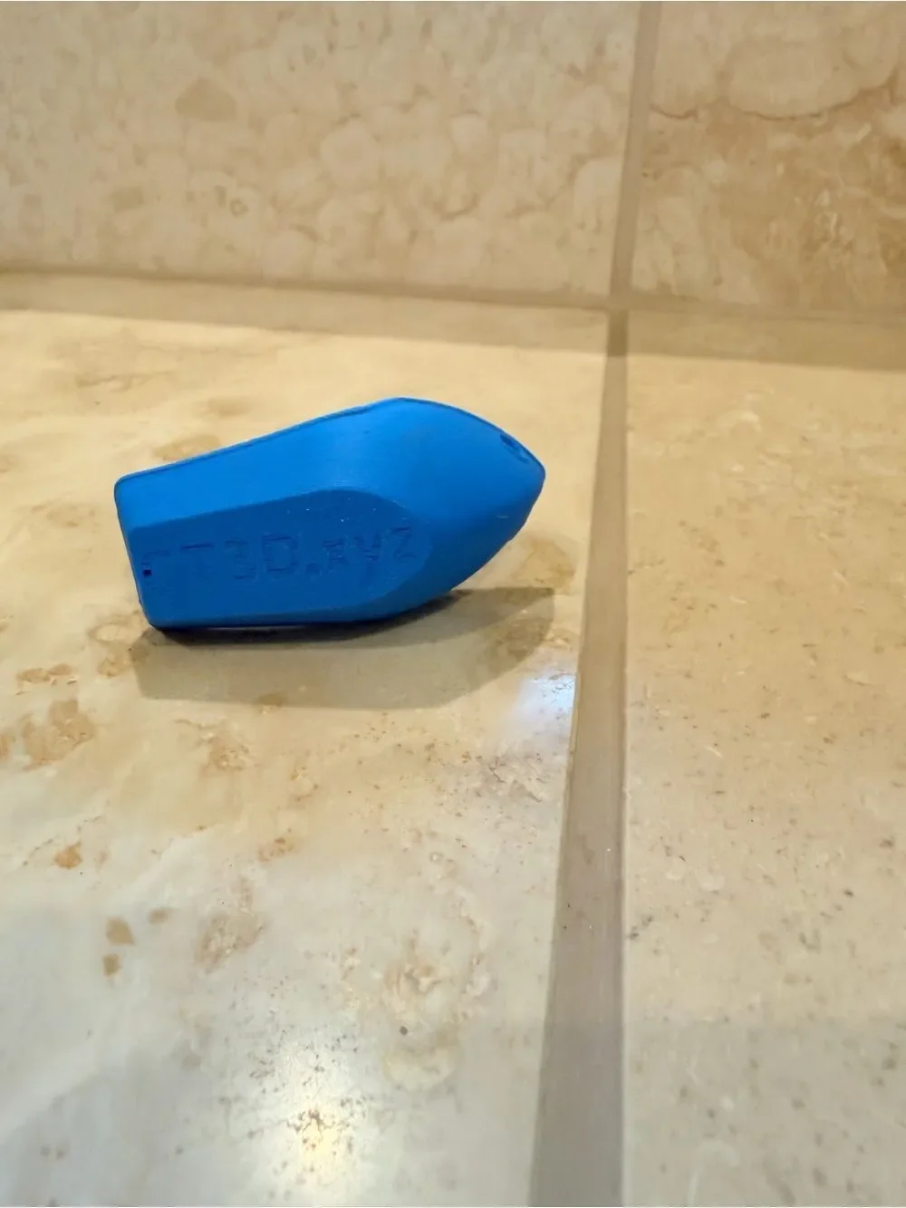 Small 3D-Printed Toy Boat in Bright Blue